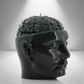 A dark grey soy candle shaped like a human head with an exposed brain design, featuring a wick on top. Sleek and detailed.
