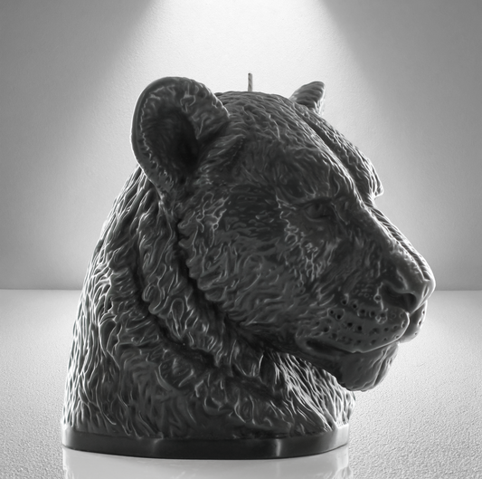 45 side view of bold dark grey candle sculpted as a lioness head, showcasing detailed fur and a powerful, elegant design perfect for decor.