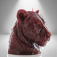 45 side view of bold dark red candle sculpted as a lioness head, showcasing detailed fur and a powerful, elegant design perfect for decor.