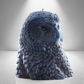 Navy Blue owl shaped candle with detailed feather design, set against a gray background