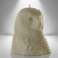 Soy unscented candle shaped like an owl, featuring intricate feather details and a bold, elegant design inspired by Athena