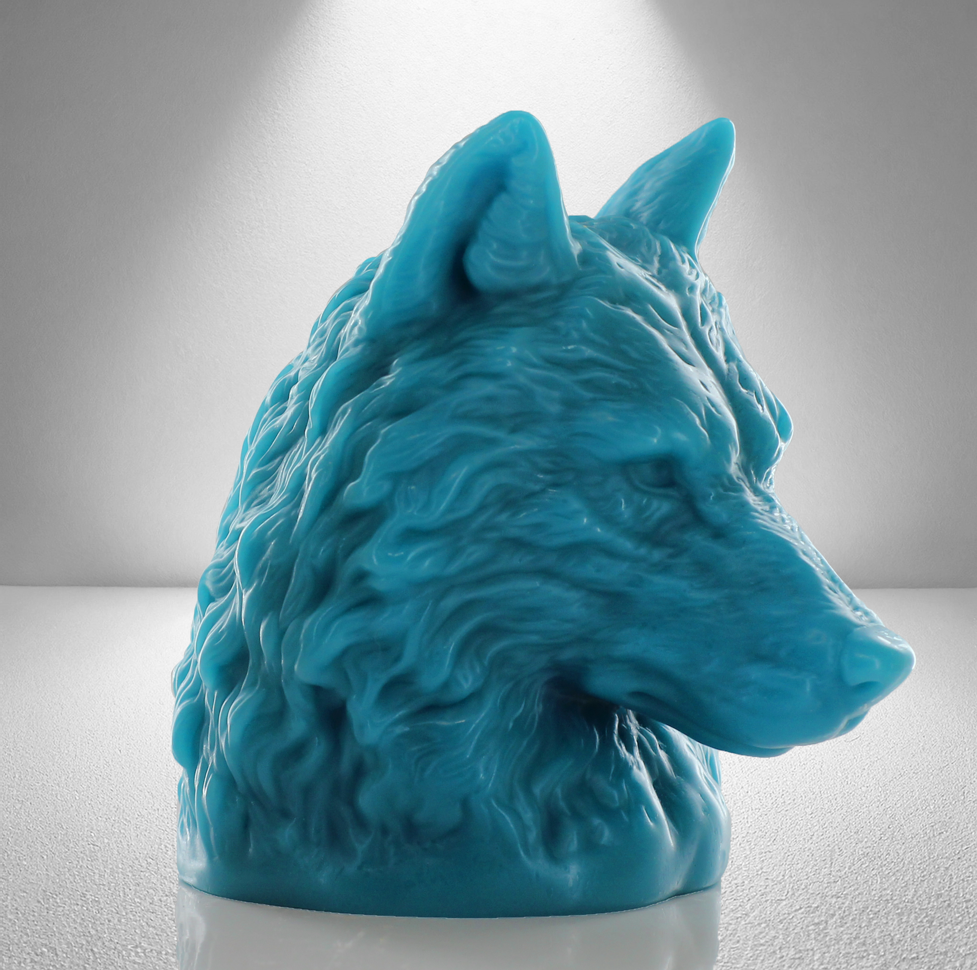 Large aquamarine unscented candle shaped like a wolf's head, featuring intricate fur details and a bold, majestic design.