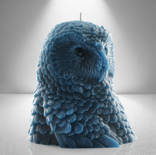 Teal unscented candle shaped like an owl, featuring intricate feather details and a bold, elegant design inspired by Athena